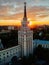 Evening summer Voronezh cityscape. Tower in architecture Stalinist empire at crimson sunset