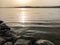 Evening sun and light over lake with reflections and peaceful ripples in Lake Murten in Switzerland