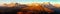 Evening sunset colored panoramic view of Alps Dolomites mountains from Col di Lana, Tofana, Fanes and others, Italian dolomites