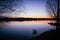 Evening sunset at Gentofte lake in the danish capital Copenhagen, with a swan