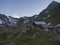 Evening sunset summer view of Bremer Hutte, an alpine mountian wooden hut with snow-capped moutain peaks, Stubai Alps