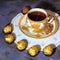 Evening tea party. Porcelain cup with tea and dessert chocolate