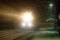 Evening train arrives at station. Snowfall