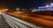 Evening view of the Almaty city. Light trails on motorway highway