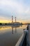 Evening view the bridge over the river Moskva or Moscow. Beautiful reflections of the colorful sky over the surface of the water.