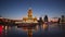 Evening view of the hotel `Ukraine` and the tourist boat, sailing along the Moskva river, Moscow