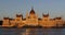 Evening view of the illuminated building of the Hungarian Parliament in Budapest.