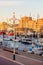 Evening view of Scheveningen harbour with boats, apartment buildings, bars and restaurants in The Hague