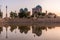 Evening view of a small pond and Dorut Tilavat complex with Kok Gumbaz mosque in Shahrisabz, Uzbekist