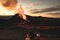 Evening view of the volcano eruption in Iceland. People are watching the fiery river