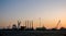 Evening view of Zayed Port with docked ships and oil rigs