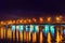 Evening Voronezh city, Russia. Illuminated Chernavsky bridge with reflections in water on Voronezh water reservoir at night