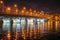 Evening Voronezh city, Russia. Illuminated Chernavsky bridge with reflections in water on Voronezh water reservoir at night