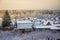 Evening winter sunset over suburban houses on horizont. Winter