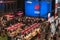 Event broadcasting a rugby match for the 2019 Rugby World Cup in Japan on a huge screen with stands decorated with the flag of