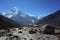 Everest trek, Huge boulder, view of Ama Dablam mountain. Himalayas, Nepal