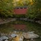 Everett Covered Bridge Reflects In Creek Below