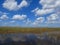 Everglades panorama with water refelction and blue sky