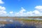 Everglades panorama with water refelction and blue sky