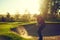 Every game comes with its challenges. a young man hitting the ball out of the bunker during a round of golf.