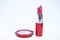 Every girl needs beauty products. Cosmetics and beauty care concept. Lipstick and eyeshadows close up white background