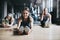 Every workout routine starts with a warmup. Full length shot of three attractive and athletic women stretching before