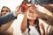 Everybody put your glasses up. Low angle shot of a group of young friends making a celebratory toast in a bar.