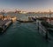 Everyday life of a gondolier. Walking on the bridges of the old city of Venice. Bright sun. The beauty of the ancient city. Italy