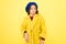 Everyone needs coat this winter. Girl fashionable cute model wear yellow wool coat. Pensive child in warm clothes
