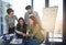 Everyones ideas are crucial to success. Shot of a group of colleagues looking through some paperwork in an office.