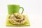 Everything bagel with fresh coffee in green mug