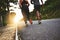 Everything is better with a partner. Low angle shot of an unrecognizable couple out running together.