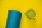 Everything for sports turquoise, blue shades on a yellow background and spinach smoothies. Yoga mat, sport shoes