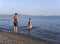 Evia Island, Greece. July 2019: Tourists and vacationers swim in the Aegean sea and relax on the beach on a summer day on a Greek