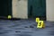 Evidence with yellow CSI marker for evidence numbering on the residental backyard in evening. Crime scene investigation concept