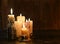 Evil candles on wooden background