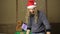 Evil dwarf or bad santa gifts guards with a wooden mallet