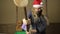 Evil dwarf or bad santa gifts guards with a wooden mallet