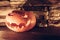 Evil halloween Jack O lantern in spotlight on dark on stone background with copy space