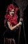 Evil red-haired witch and her broomstick