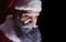 Evil Santa Claus grimaces and scares a terrible face