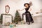 The evil witch in black dress and scary hat from Halloween came for Christmas and tries to spoil a holiday, swinging the
