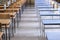 Exam examination room or hall set up ready for students to sit test. multiple desks tables and chairs. Education, school, student