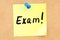 Exam. Text on a sticky note pinned to a corkboard. 3D rendering