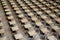 Examination hall set up with chairs and wooden desks. Photographed at Queen Mary, University of London