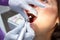 Examination oral cavity or treatment teeth, visiting dental office, blurred background