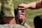 Examination of the teeth of a hunting dog at an exhibition of hunting and service dog breeds. The woman reaches into the mouth of