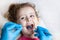 Examination, treatment teeth children. medical checkup oral cavity with instruments