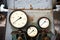 Example of chemical plant steampunk retro style equipment three pressure gauges or manometers show zero closeup with out