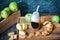 An example of a photo of healthy regular food. Fruits apples and smoothies in a bottle